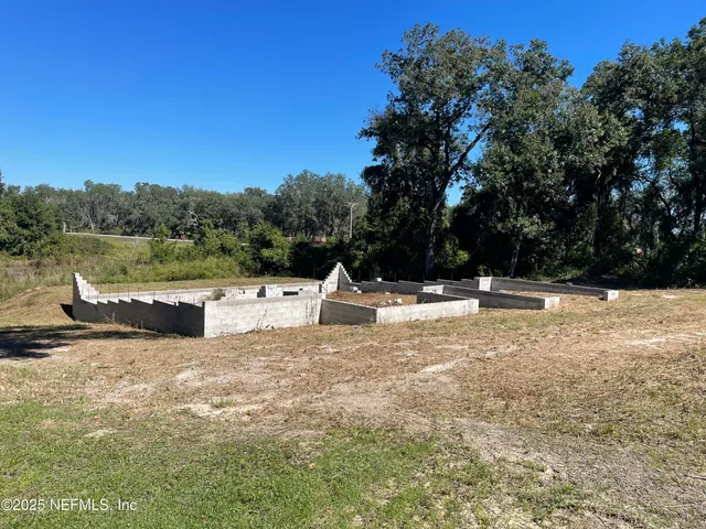 a view of swimming pool with a yard