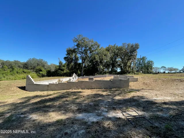 a view of swimming pool with a yard