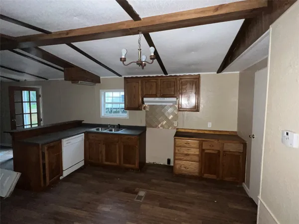 a kitchen with stainless steel appliances granite countertop a stove and a refrigerator