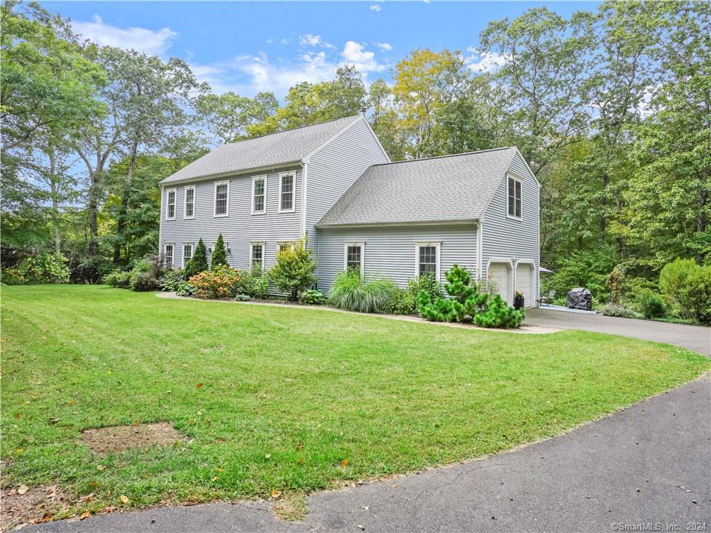 46 Harrison Road Guilford, CT 06437 - Photo 1 of 1 a view of a house with backyard and garden