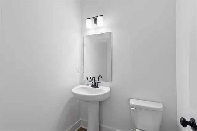 an empty room with window and ceiling fan