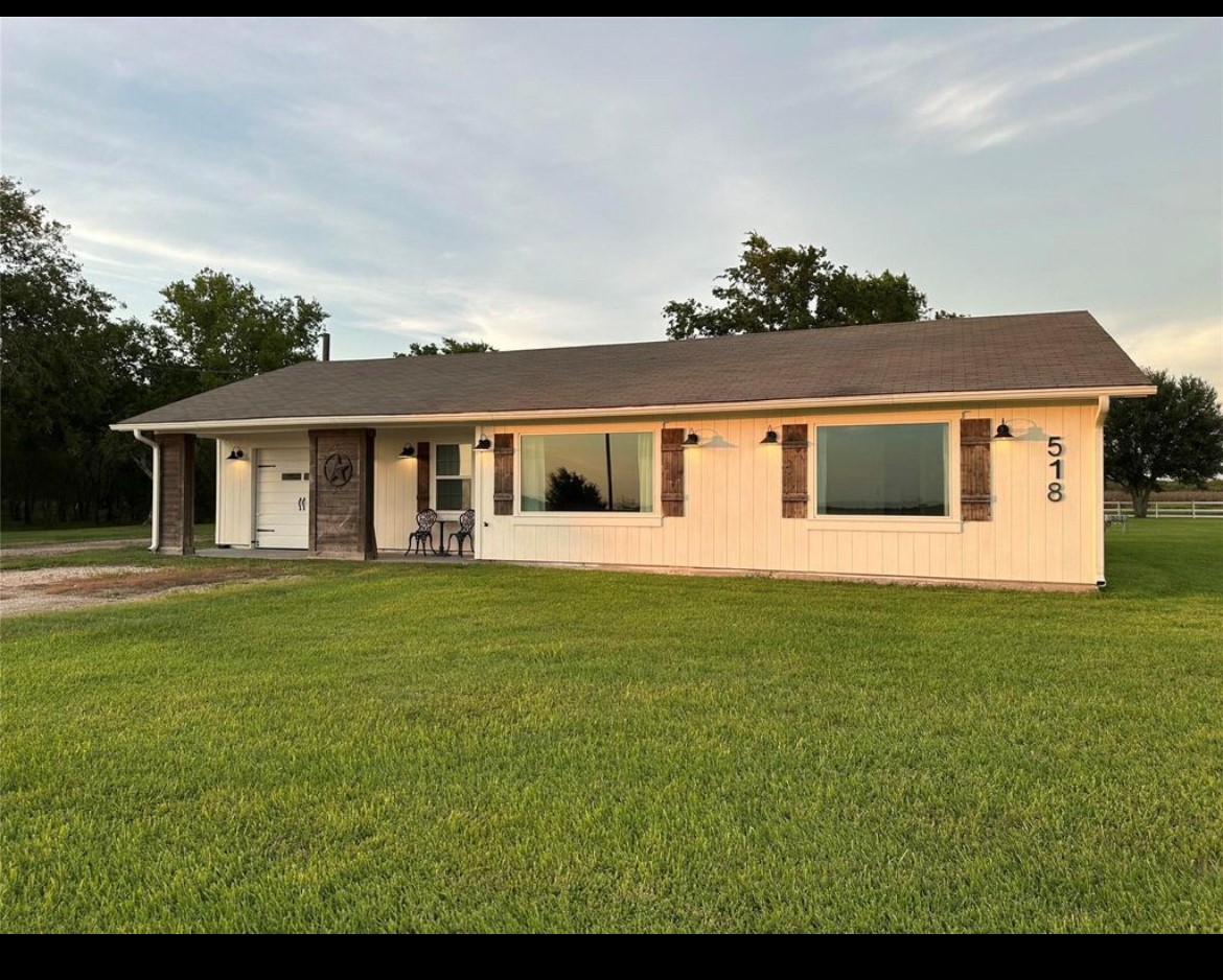 518 Anton Stade Road, Unit B Rosenberg, TX 77471 - Photo 3 of 11 a front view of a house with a garden