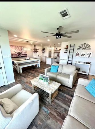 a kitchen with stainless steel appliances kitchen island granite countertop a stove and a sink