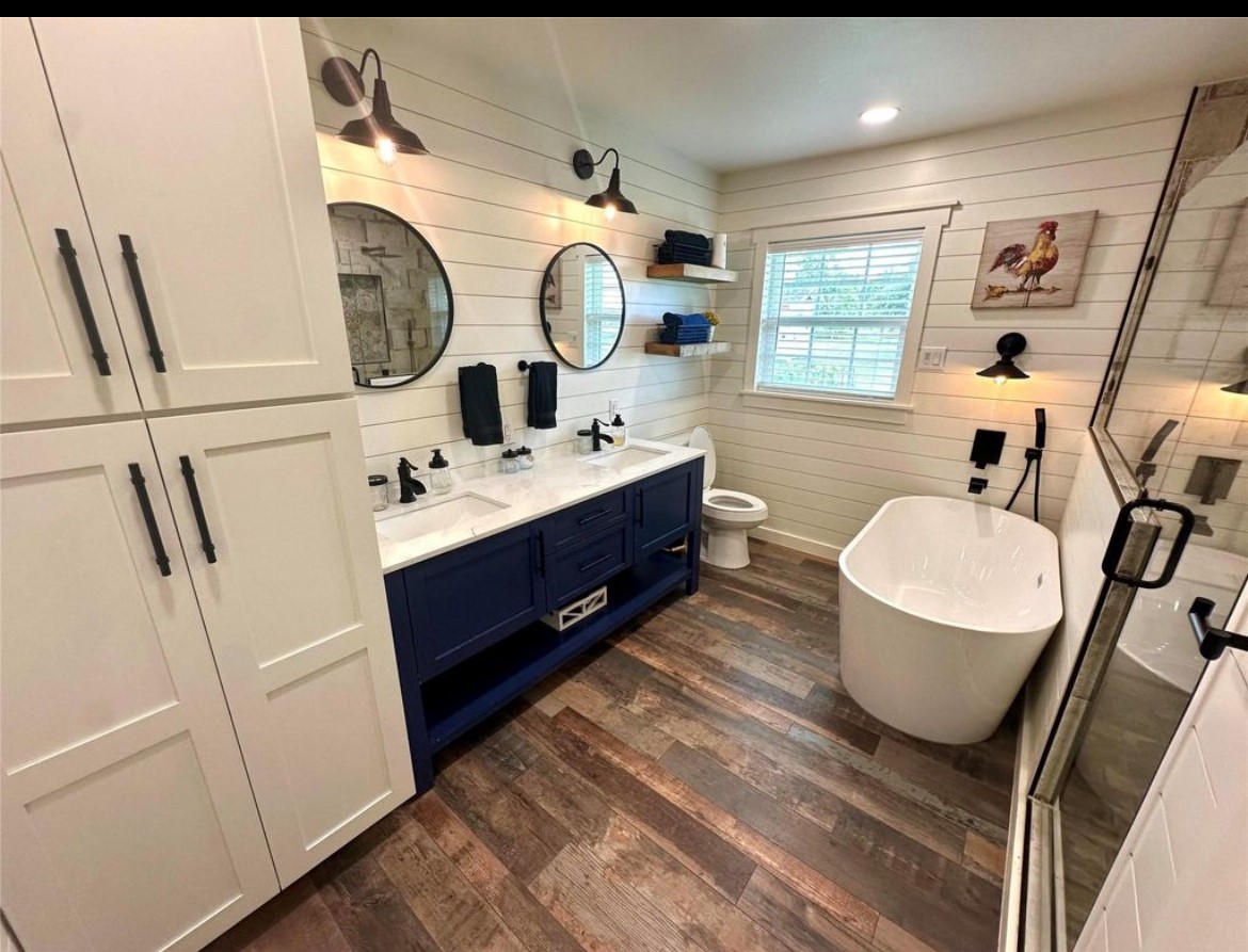 518 Anton Stade Road, Unit B Rosenberg, TX 77471 - Photo 6 of 11 a bathroom with a double vanity sink and mirror