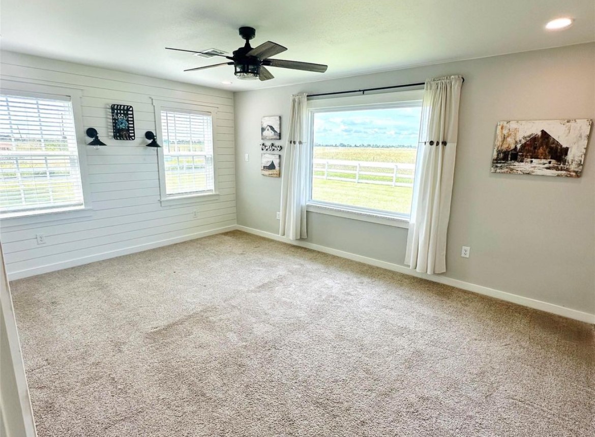 518 Anton Stade Road, Unit B Rosenberg, TX 77471 - Photo 10 of 11 a view of an empty room with a window