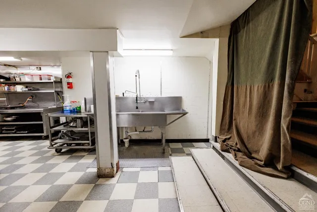 a kitchen with a sink and cabinets