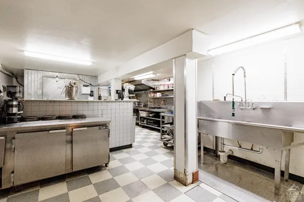 a view of a building with sitting area