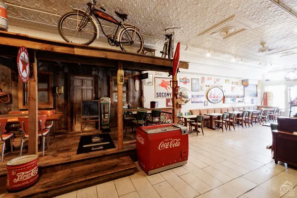 a view of a cafe with sitting area