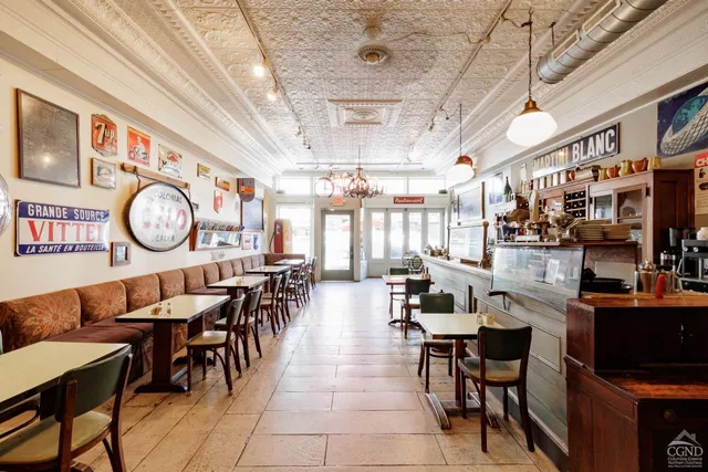 a dining hall with lots of tables and chairs