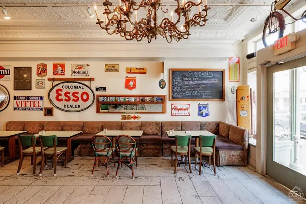 an outdoor space with a table and chairs