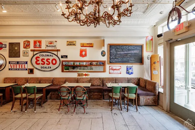 an outdoor space with a table and chairs