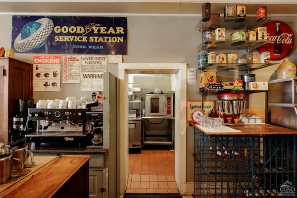 a kitchen with stainless steel appliances granite countertop a stove and a refrigerator