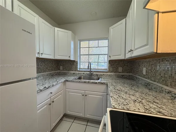 $1,850 | 4140 Woodside Drive, Unit 107, Coral Springs, FL 33065