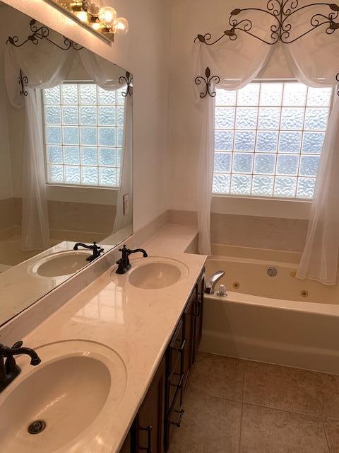 136 Gail La Rue Fort Walton Beach, FL 32547 - Photo 13 of 31 a bathroom with a tub sink and mirror