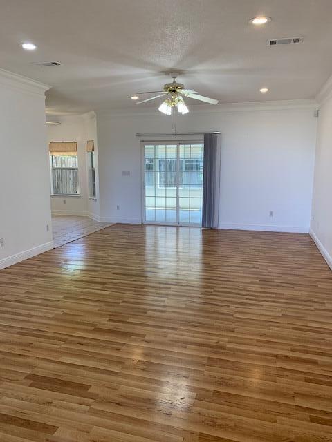 136 Gail La Rue Fort Walton Beach, FL 32547 - Photo 3 of 31 an empty room with wooden floor and windows