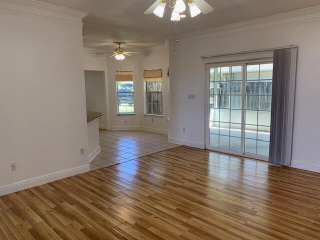 136 Gail La Rue Fort Walton Beach, FL 32547 - Photo 4 of 31 wooden floor in an empty room with a window