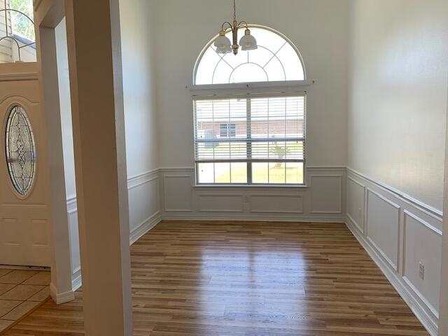136 Gail La Rue Fort Walton Beach, FL 32547 - Photo 5 of 31 a view of empty room with wooden floor and fan