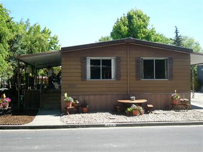188 Rancho Verde Circle, Unit 188 Rohnert Park, CA 94928 - Photo 1 of 12 Front of spacious mobile home with two car garage and lovely sitting area in front.