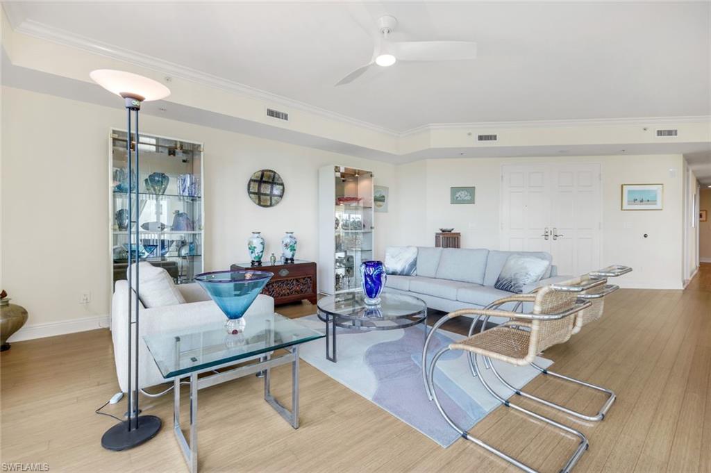 285 Grande Way, Unit 401 Naples, FL 34110 - Photo 11 of 50 a living room with furniture