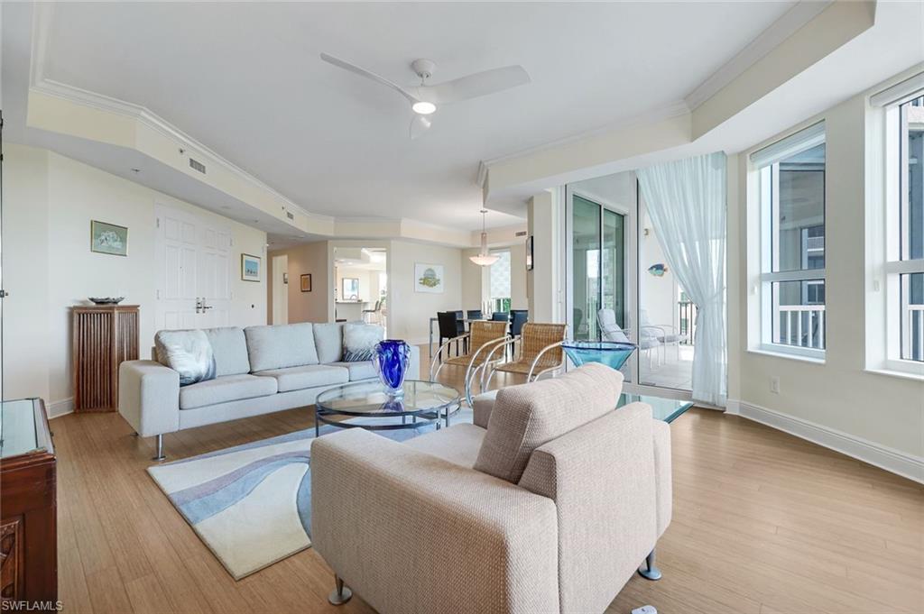 285 Grande Way, Unit 401 Naples, FL 34110 - Photo 49 of 50 a living room with furniture and a large window