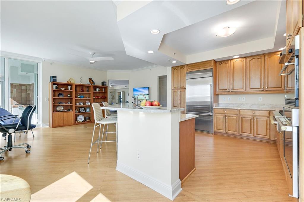 285 Grande Way, Unit 401 Naples, FL 34110 - Photo 50 of 50 a living room with stainless steel appliances furniture cabinets and a kitchen view