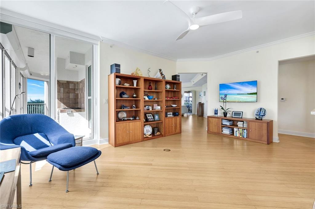 285 Grande Way, Unit 401 Naples, FL 34110 - Photo 21 of 50 a living room with furniture and a wooden floor