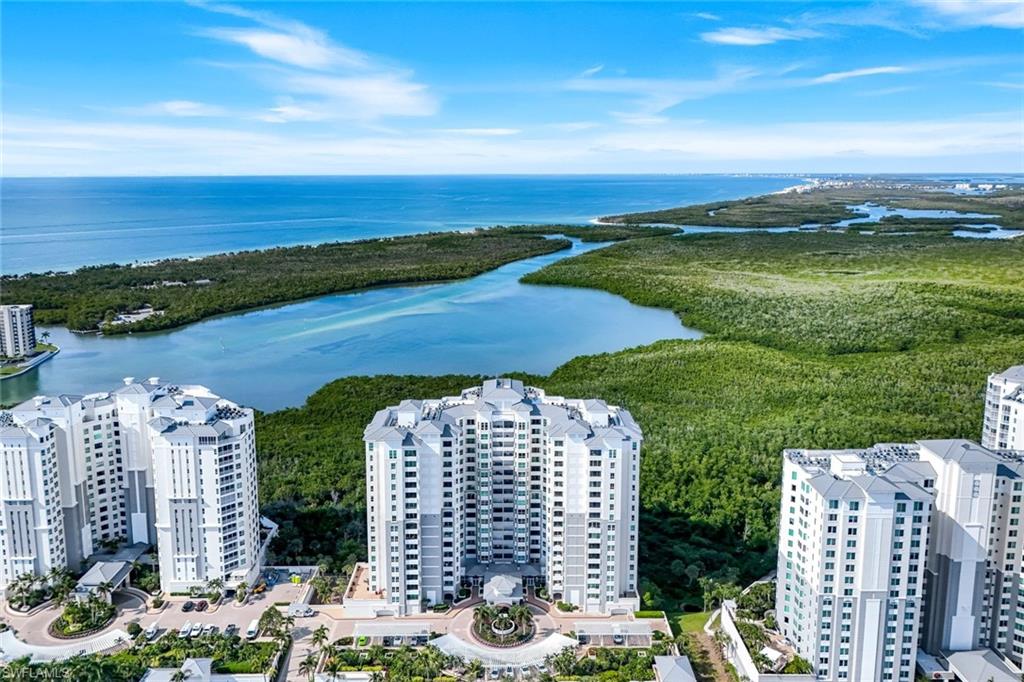 285 Grande Way, Unit 401 Naples, FL 34110 - Photo 3 of 50 a view of a city with an ocean view