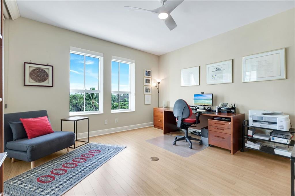 285 Grande Way, Unit 401 Naples, FL 34110 - Photo 29 of 50 a workspace with furniture and a window