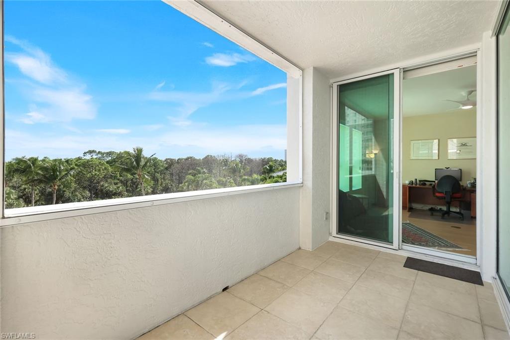 285 Grande Way, Unit 401 Naples, FL 34110 - Photo 33 of 50 a view of a balcony with an outdoor space