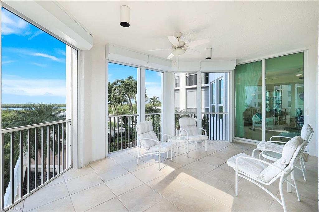 285 Grande Way, Unit 401 Naples, FL 34110 - Photo 36 of 50 a balcony with furniture