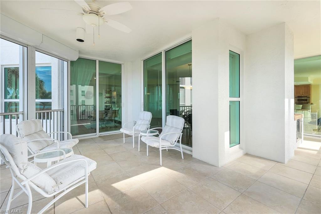 285 Grande Way, Unit 401 Naples, FL 34110 - Photo 38 of 50 a living room with furniture and a large window