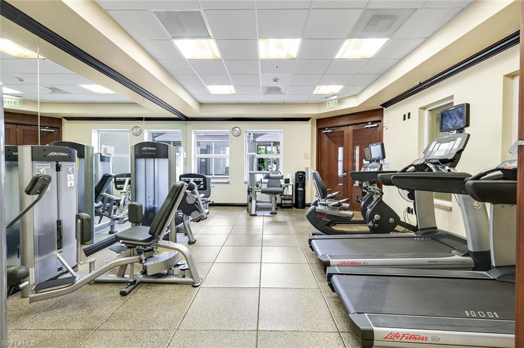 285 Grande Way, Unit 401 Naples, FL 34110 - Photo 42 of 50 a view of a room with gym equipment
