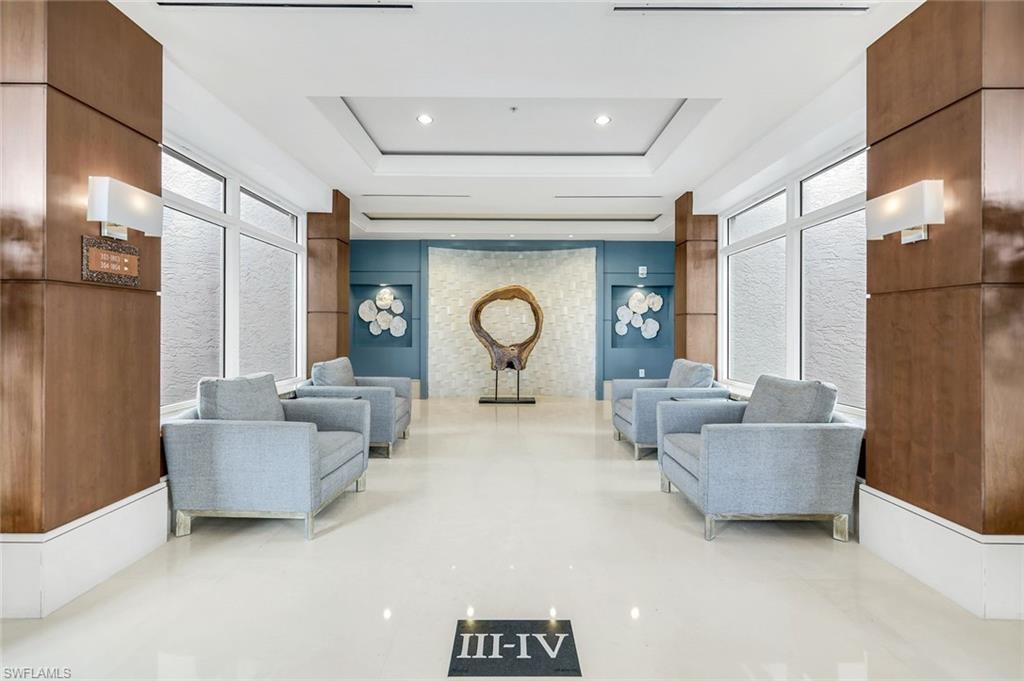 285 Grande Way, Unit 401 Naples, FL 34110 - Photo 7 of 50 a living room with furniture and a large window