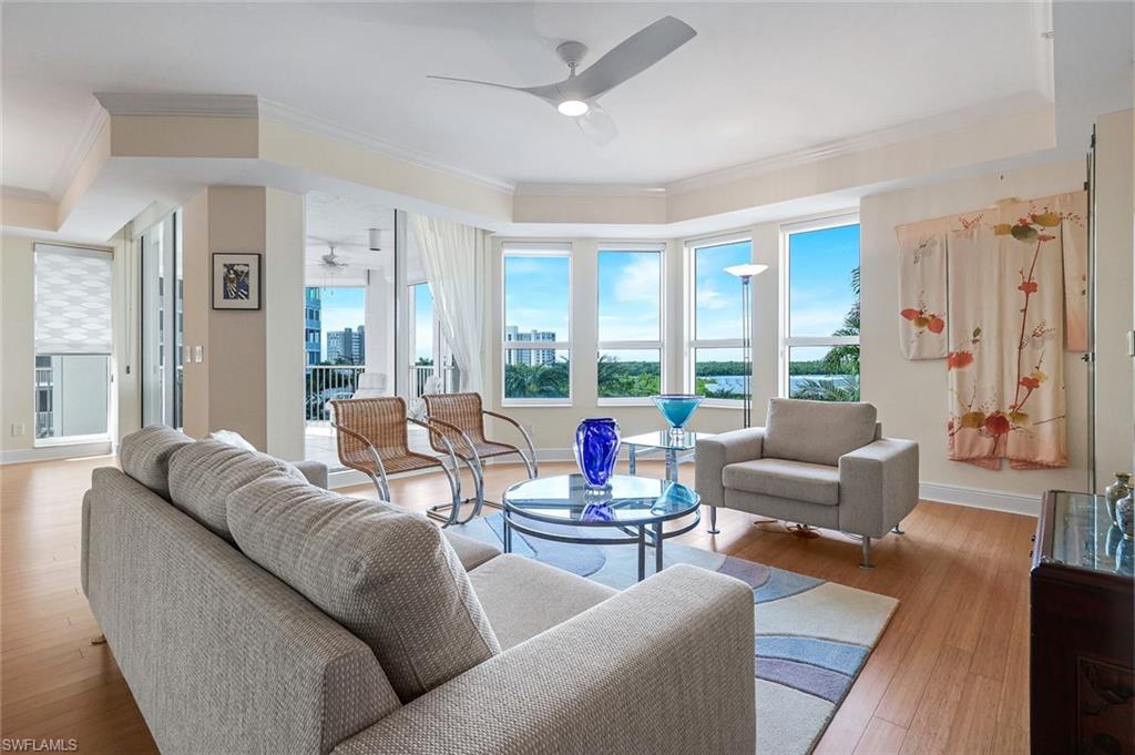 285 Grande Way, Unit 401 Naples, FL 34110 - Photo 9 of 50 a living room with furniture and a large window