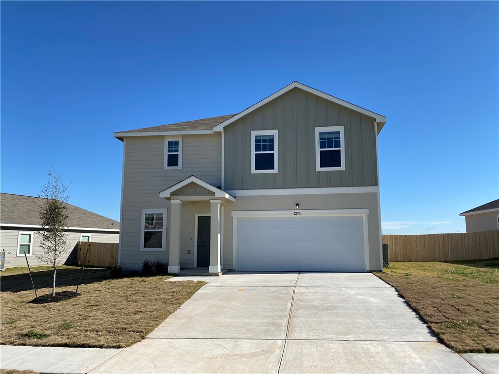 a front view of a house with yard
