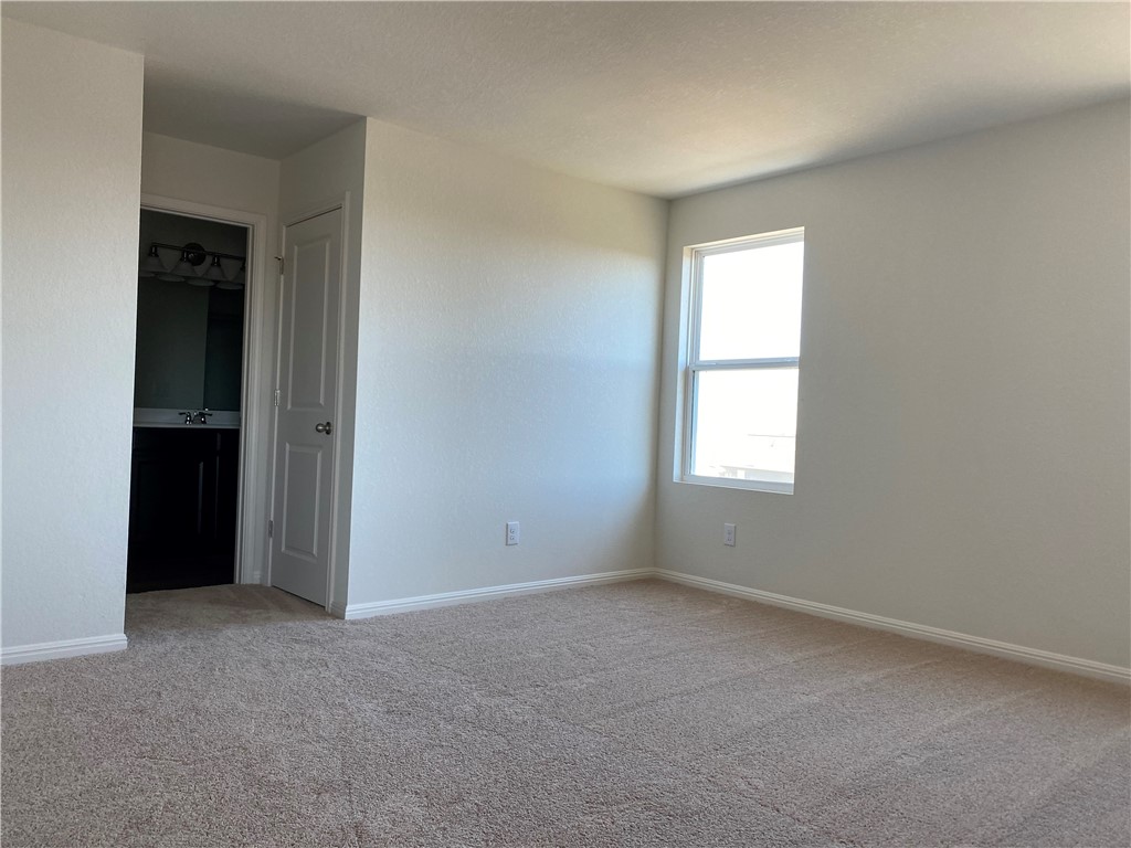 12901 Robert Lafollette Road Manor, TX 78653 - Photo 11 of 29 an empty room with windows and closet