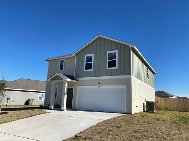 a front view of a house with a garage
