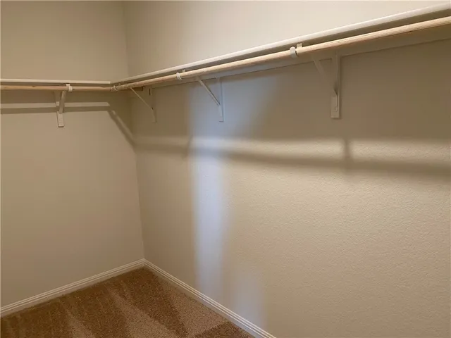 a view of a backyard with wooden fence