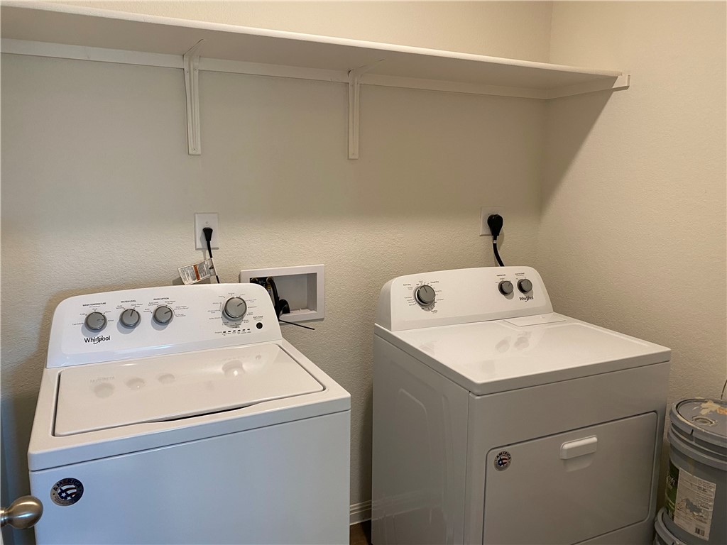 12901 Robert Lafollette Road Manor, TX 78653 - Photo 27 of 29 a utility room with dryer and washer