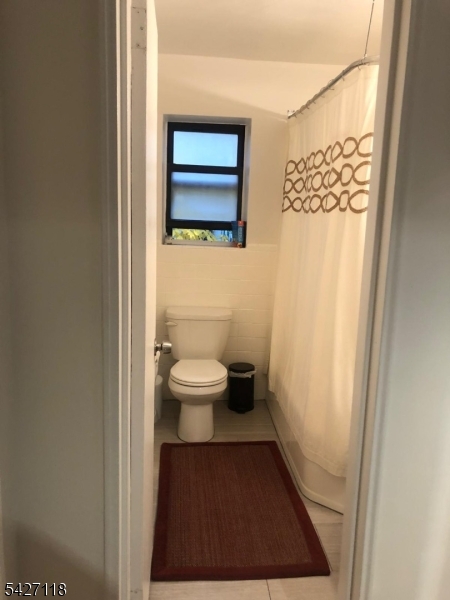 130 Orient Way, Unit 2K Rutherford, NJ 07070 - Photo 9 of 16 a bathroom with a toilet