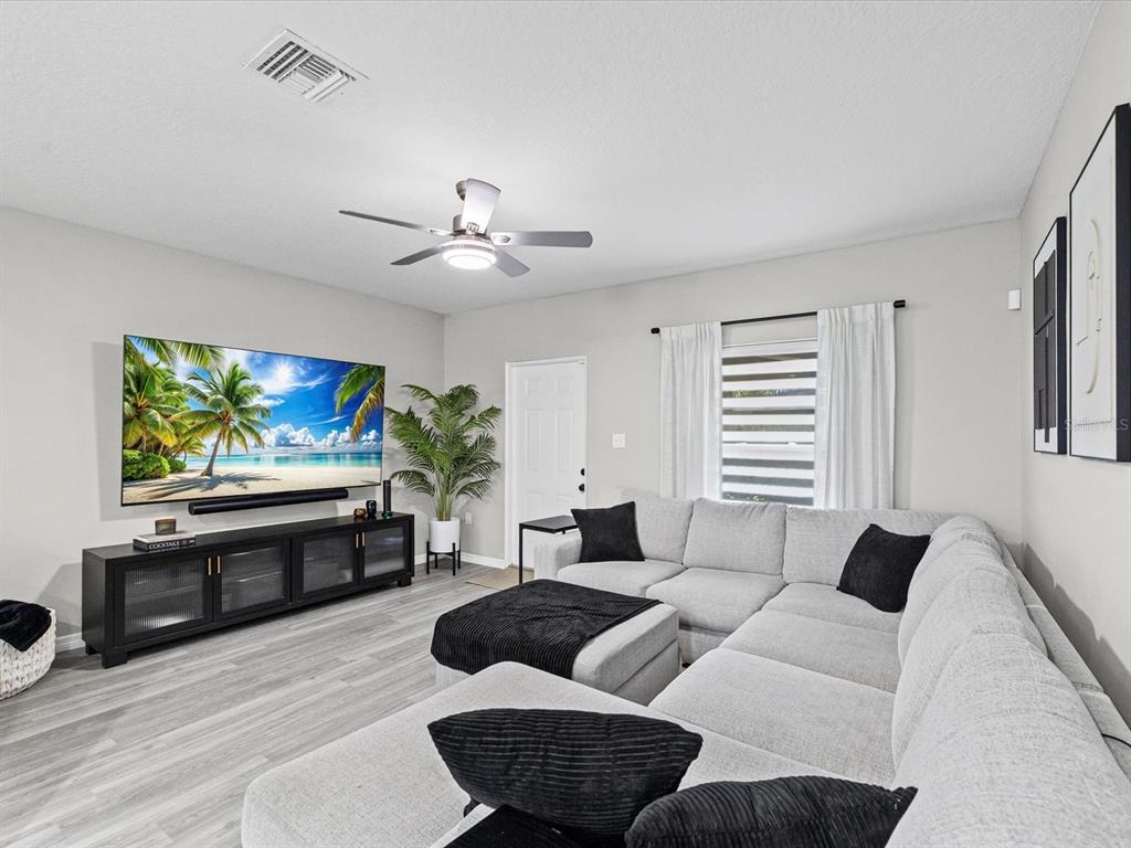 4367 Har Paul Circle Tampa, FL 33614 - Photo 12 of 31 a living room with furniture and a flat screen tv