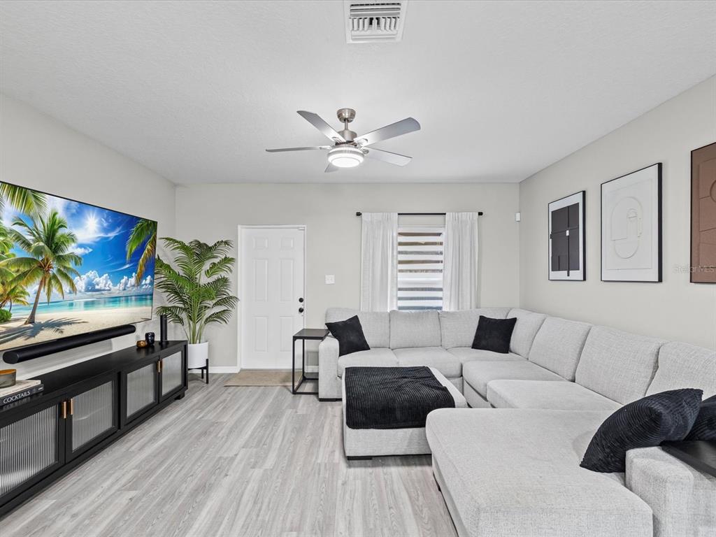 4367 Har Paul Circle Tampa, FL 33614 - Photo 13 of 31 a living room with furniture and a flat screen tv