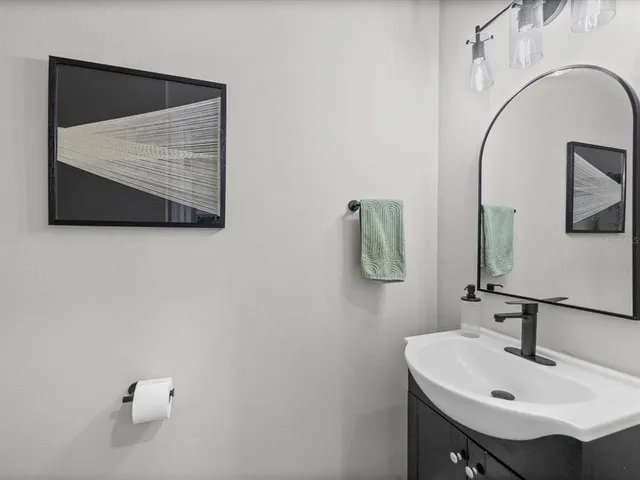 a bathroom with a sink and mirror