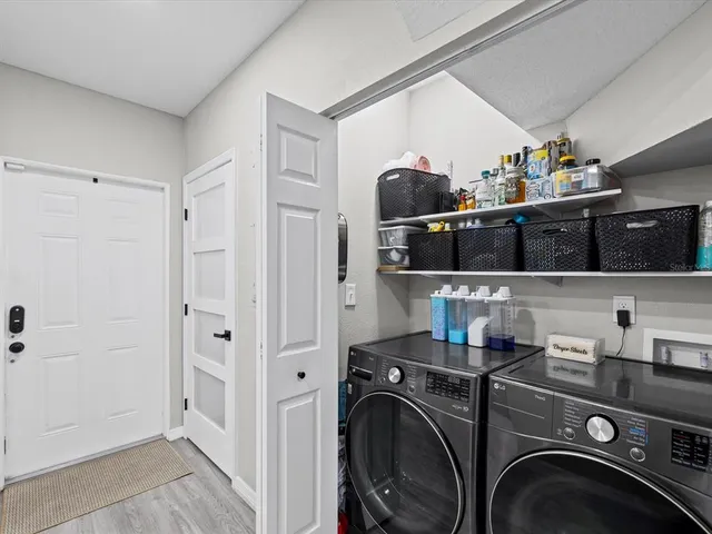 a view of a kitchen with washer and dryer