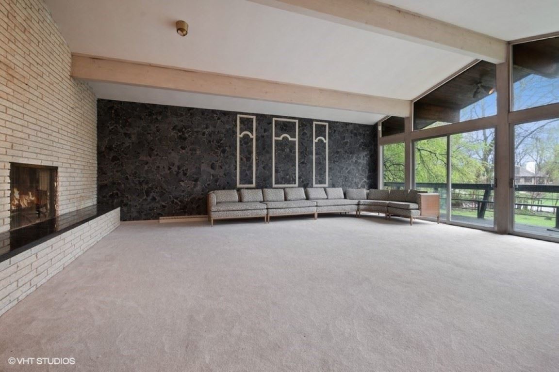 3008 Spring Creek Road Rockford, IL 61107 - Photo 11 of 24 a view of an empty room with a fireplace