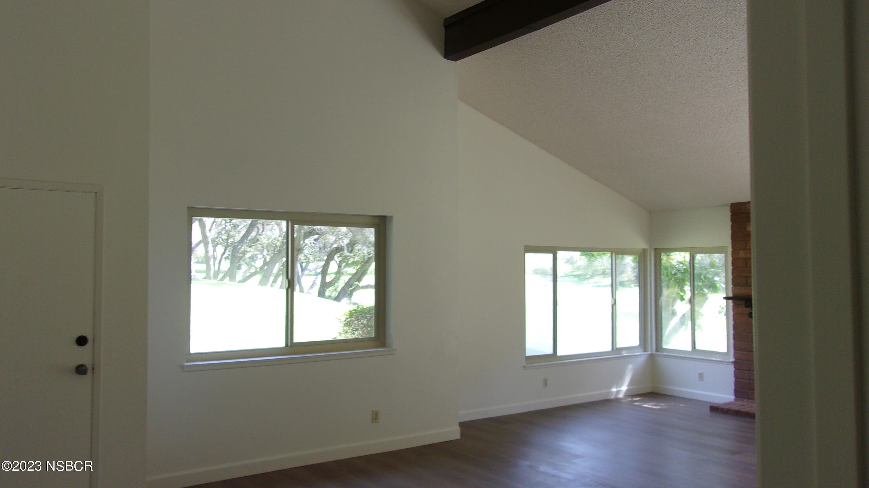 46 Stanford Circle Lompoc, CA 93436 - Photo 12 of 24 an empty room with wooden floor and windows