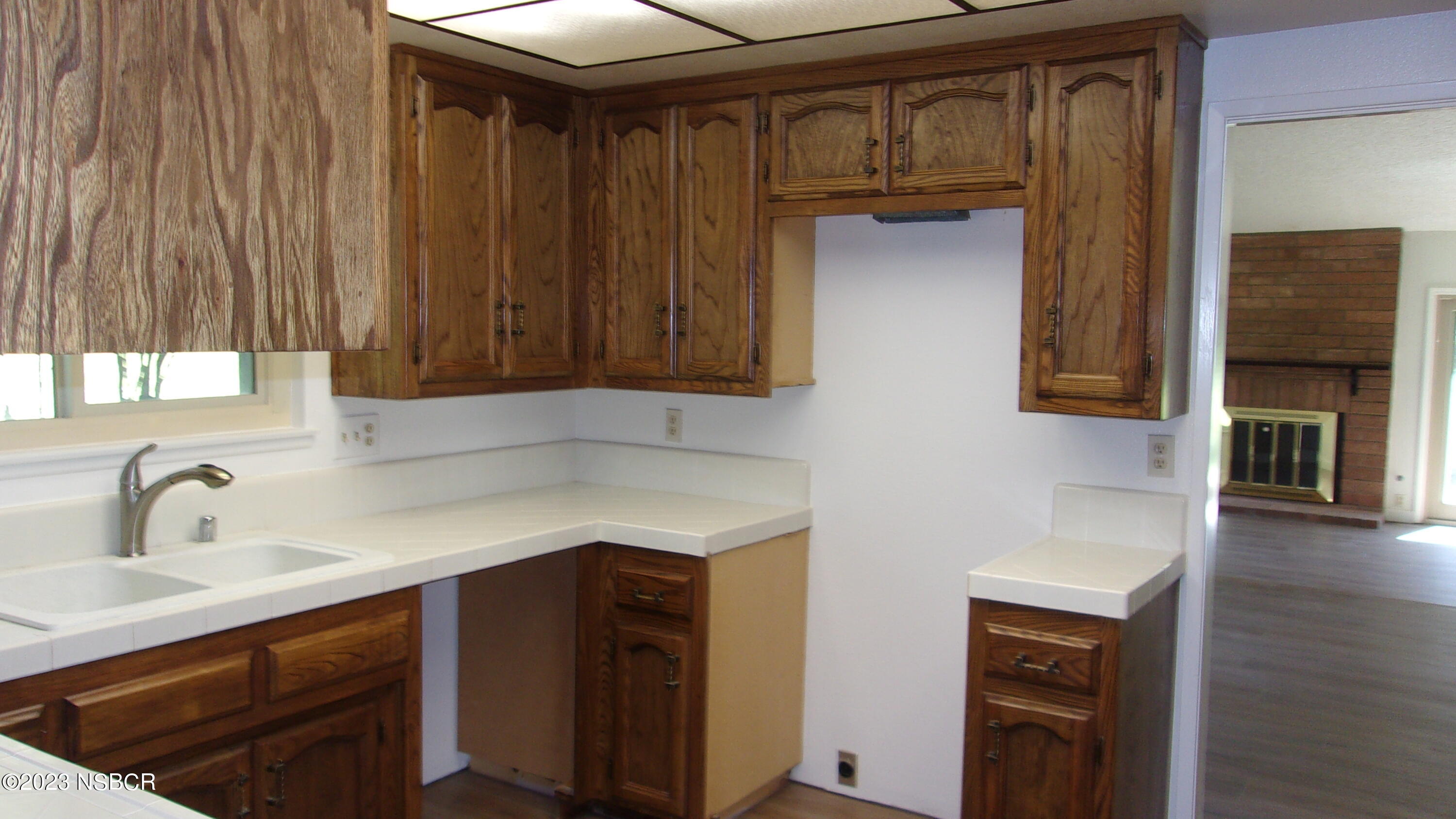 46 Stanford Circle Lompoc, CA 93436 - Photo 13 of 24 a kitchen with a sink and cabinets