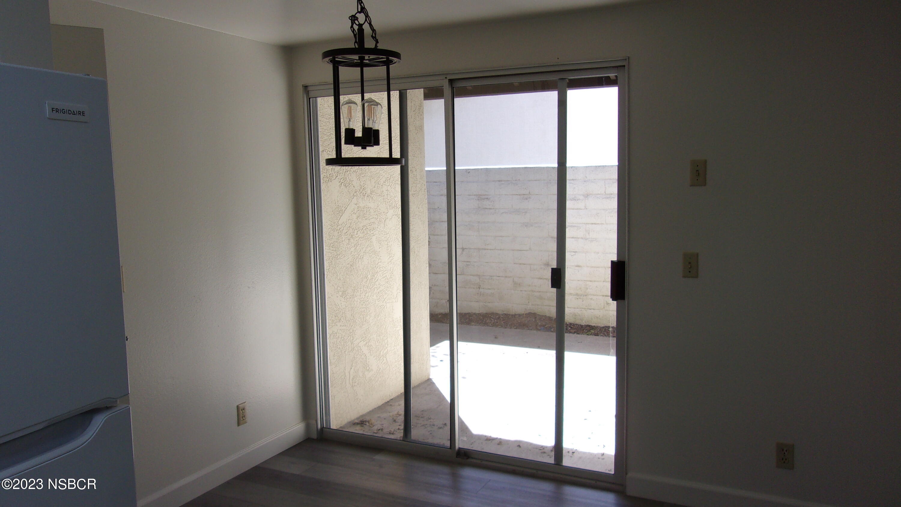 46 Stanford Circle Lompoc, CA 93436 - Photo 15 of 24 a view of hallway with chandelier and wooden floor