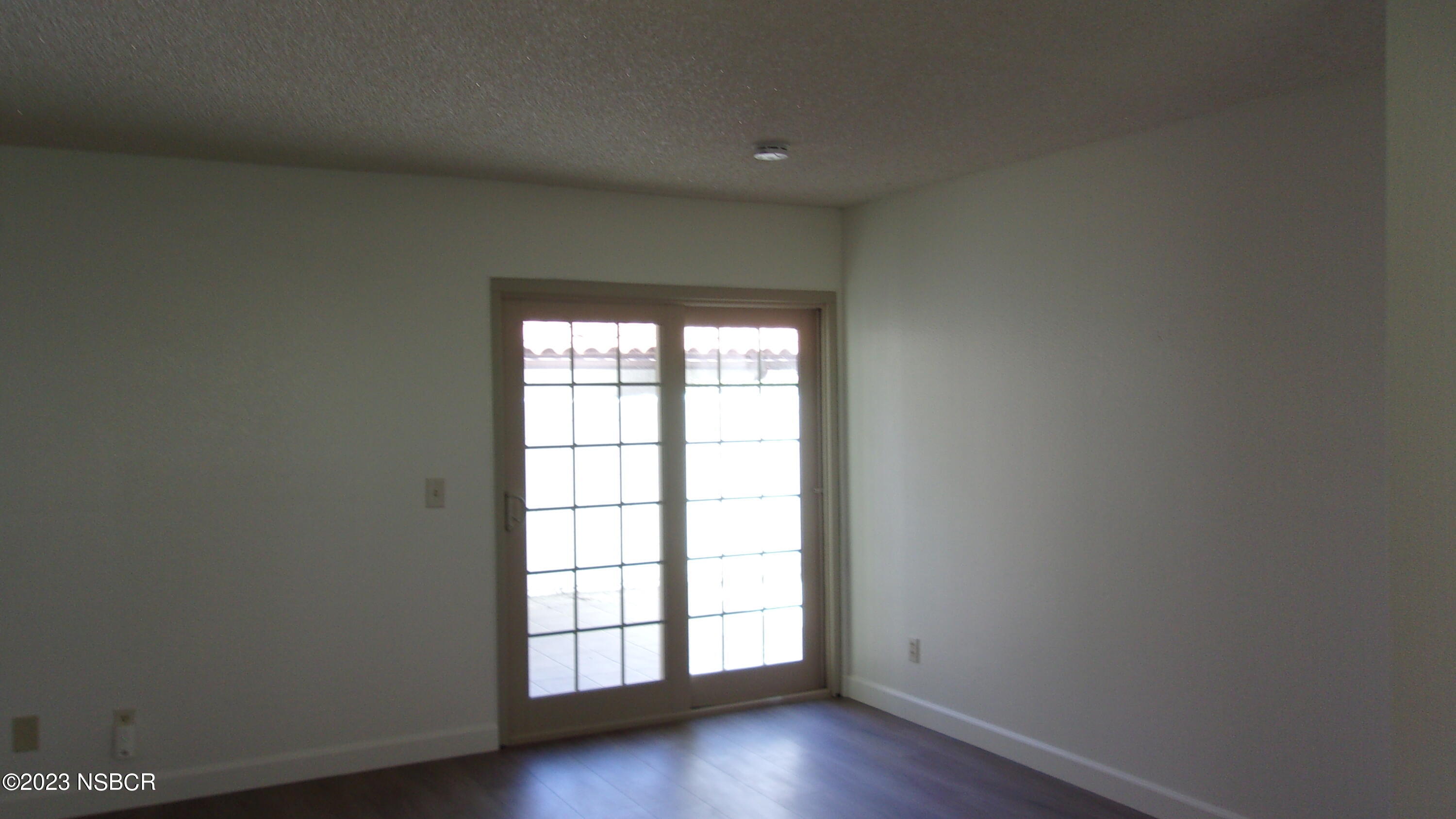 46 Stanford Circle Lompoc, CA 93436 - Photo 18 of 24 an empty room with wooden floor and window