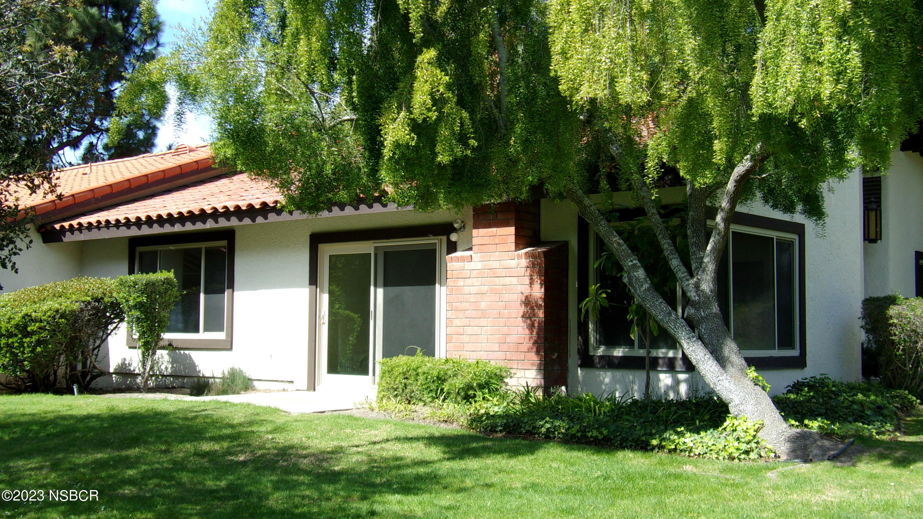 46 Stanford Circle Lompoc, CA 93436 - Photo 4 of 24 a front view of a house with a yard